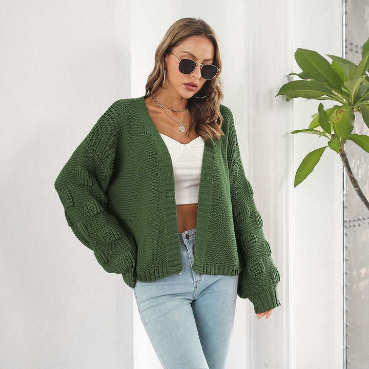 Kurze Grobstrickjacke mit Puffärmeln in Senfgelb