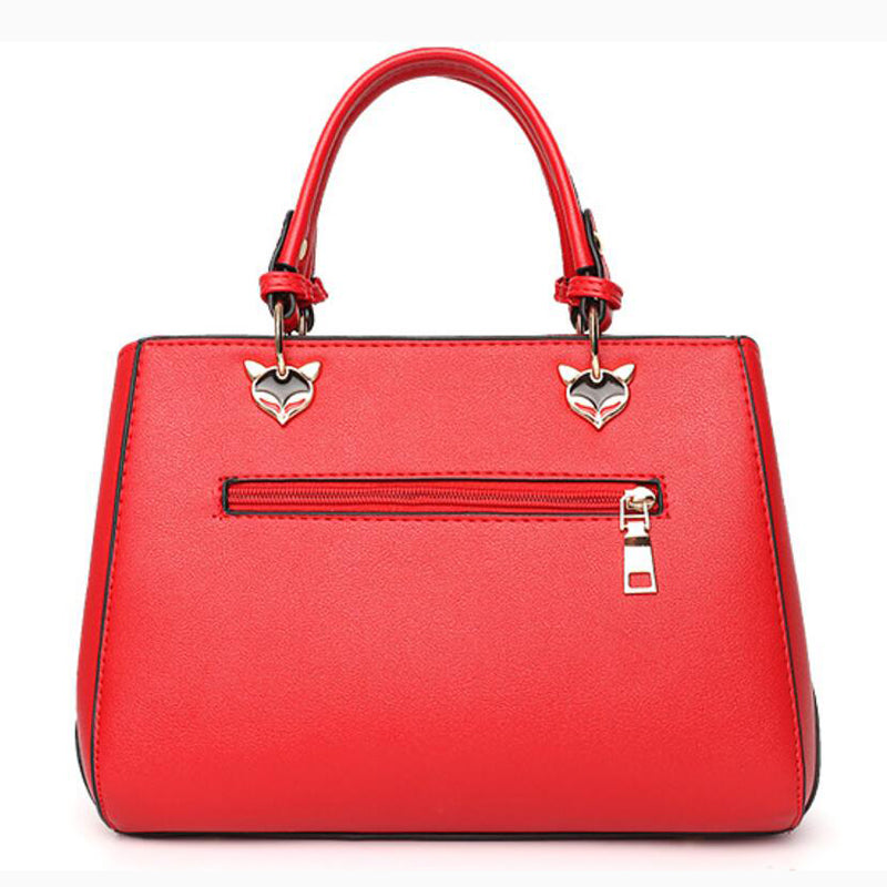Colour-Block-Handtasche mit Pompon-Anhänger