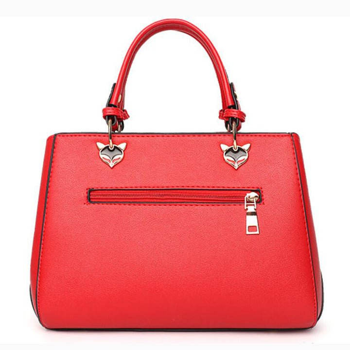 Colour-Block-Handtasche mit Pompon-Anhänger