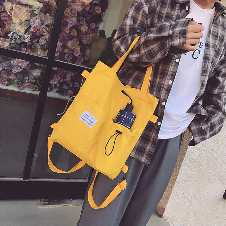 Canvas-Tasche als Rucksack und Schultertasche getragen