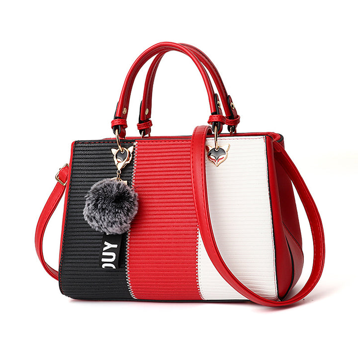 Colour-Block-Handtasche mit Pompon-Anhänger
