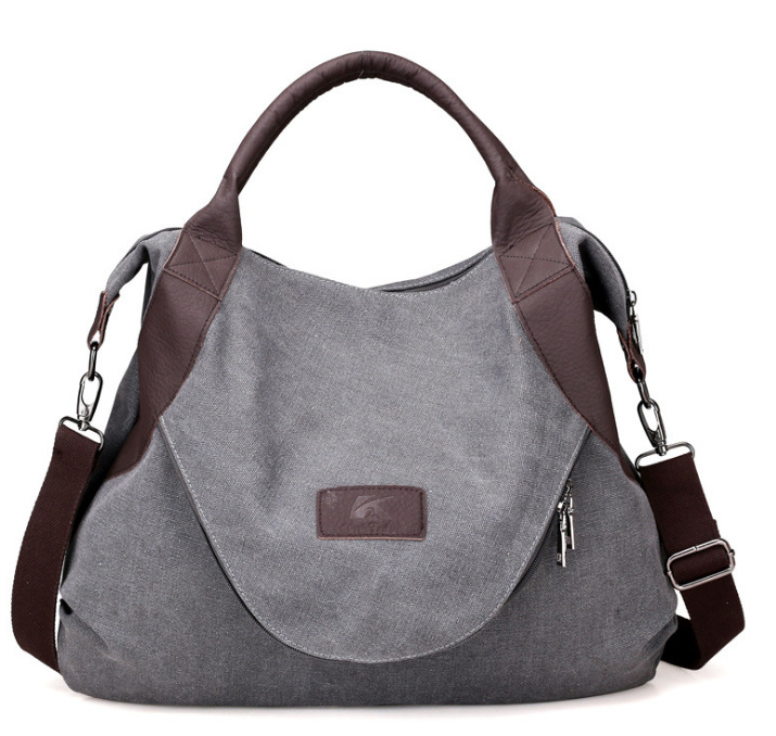 Grosse blaue Canvas-Schultertasche mit Kontrastgriffen