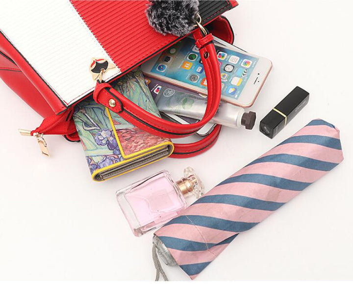 Colour-Block-Handtasche mit Pompon-Anhänger