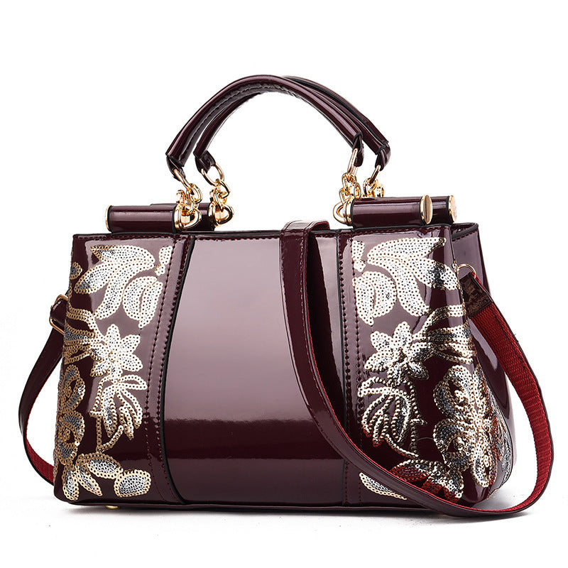 Lack-Handtasche mit Pailletten-Blumenstickerei