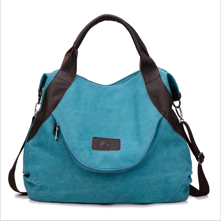 Grosse blaue Canvas-Schultertasche mit Kontrastgriffen