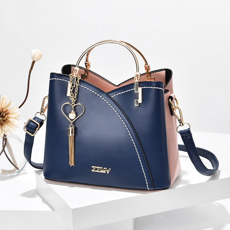 Colorblock-Handtasche mit Herzanhänger