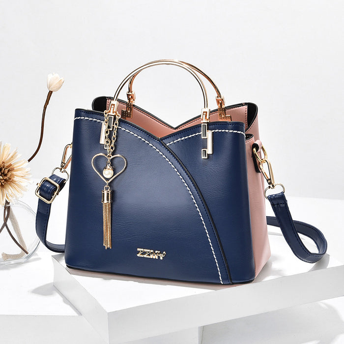 Mia | Colorblock-Handtasche mit Ringhenkeln und Herzanhänger