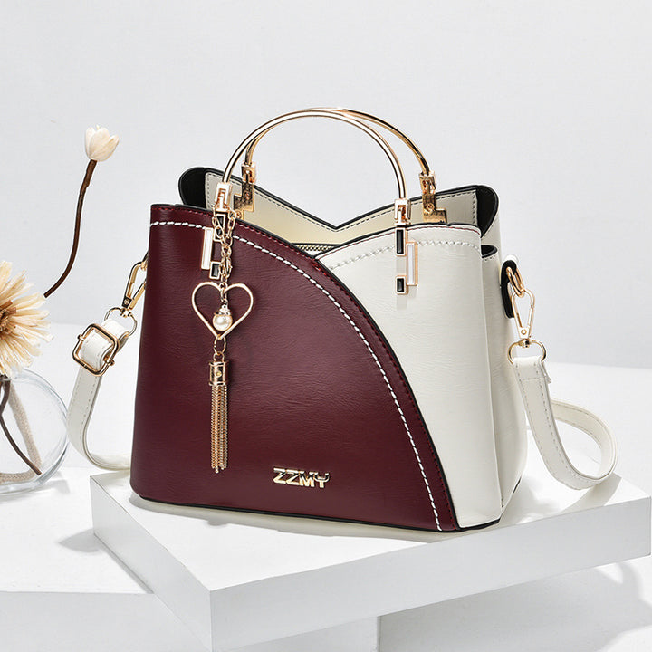Colorblock-Handtasche mit Herzanhänger