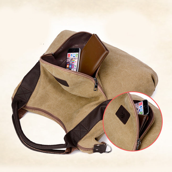 Grosse blaue Canvas-Schultertasche mit Kontrastgriffen