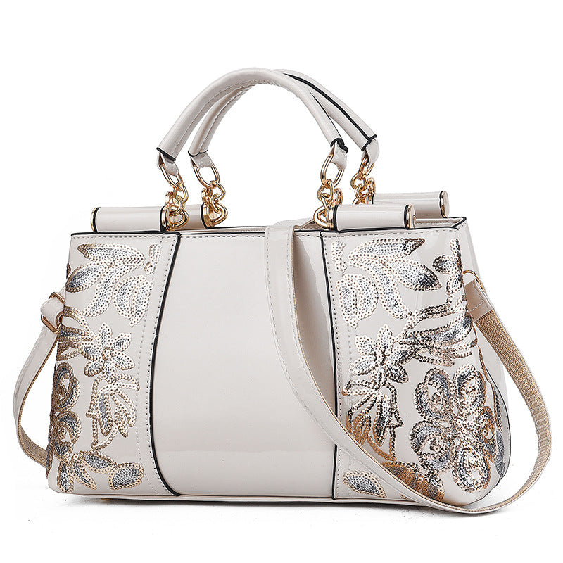 Lack-Handtasche mit Pailletten-Blumenstickerei