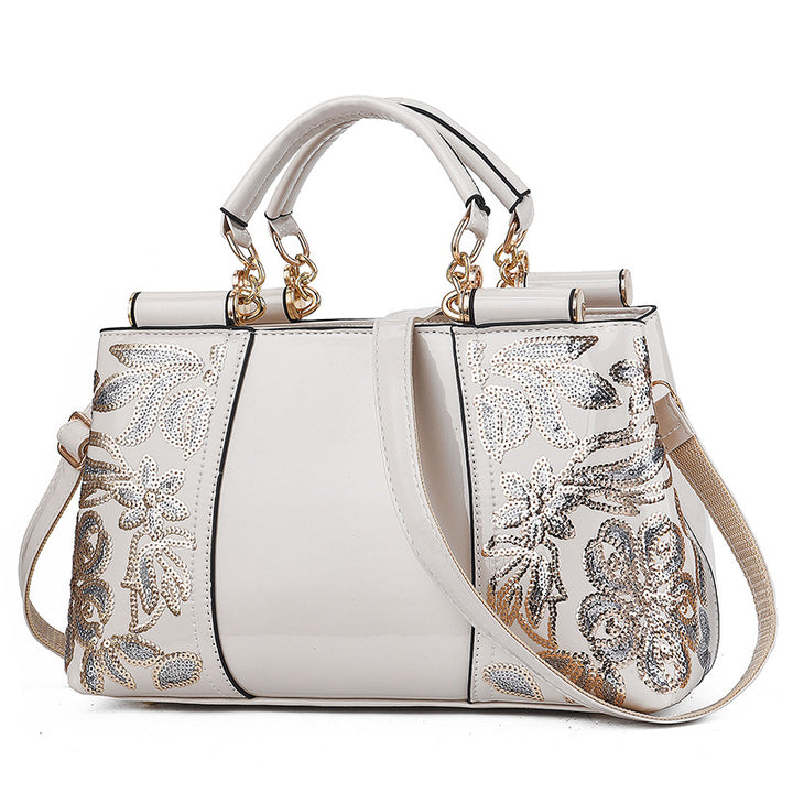 Lack-Handtasche mit Pailletten-Blumenstickerei