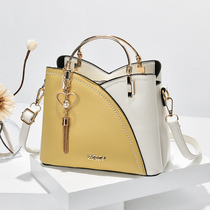 Colorblock-Handtasche mit Herzanhänger