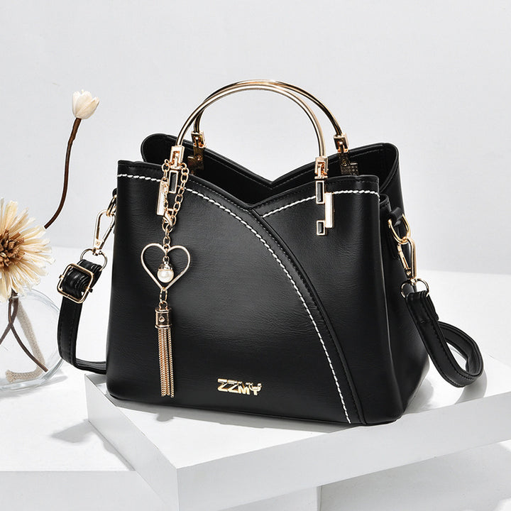 Colorblock-Handtasche mit Herzanhänger