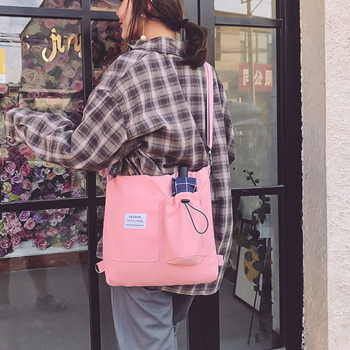 Canvas-Tasche als Rucksack und Schultertasche getragen