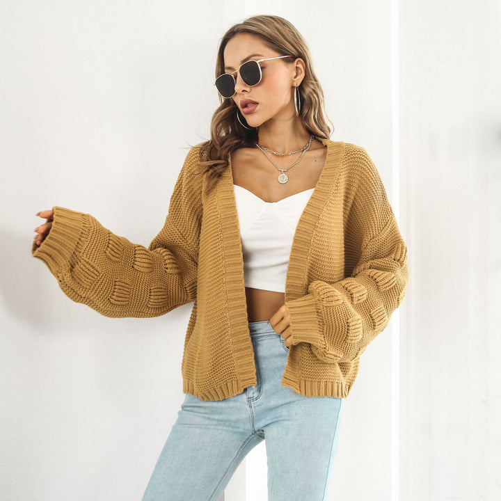 Kurze Grobstrickjacke mit Puffärmeln in Senfgelb