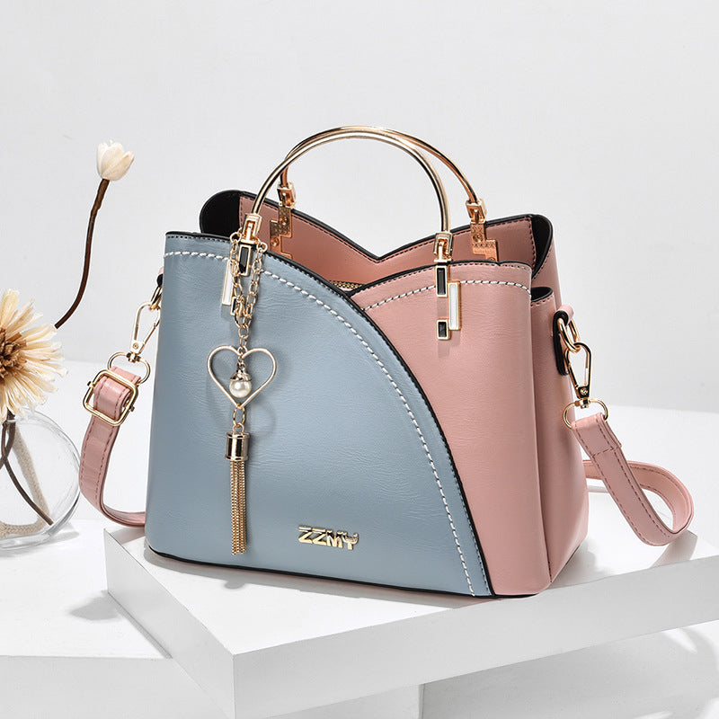 Colorblock-Handtasche mit Herzanhänger