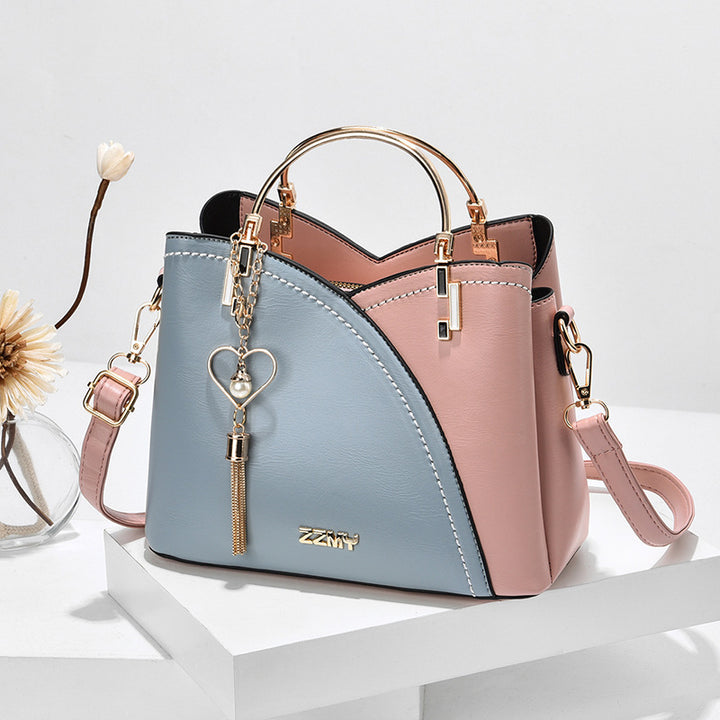 Colorblock-Handtasche mit Herzanhänger