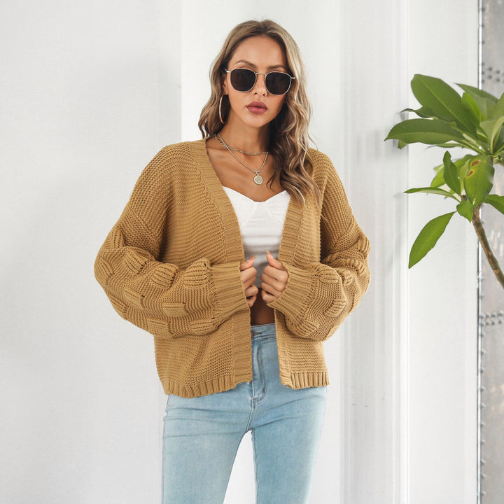 Kurze Grobstrickjacke mit Puffärmeln in Senfgelb